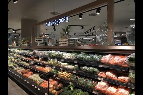 Fresh fruit and vegetables form a colourful display in the greengrocer aisle.
